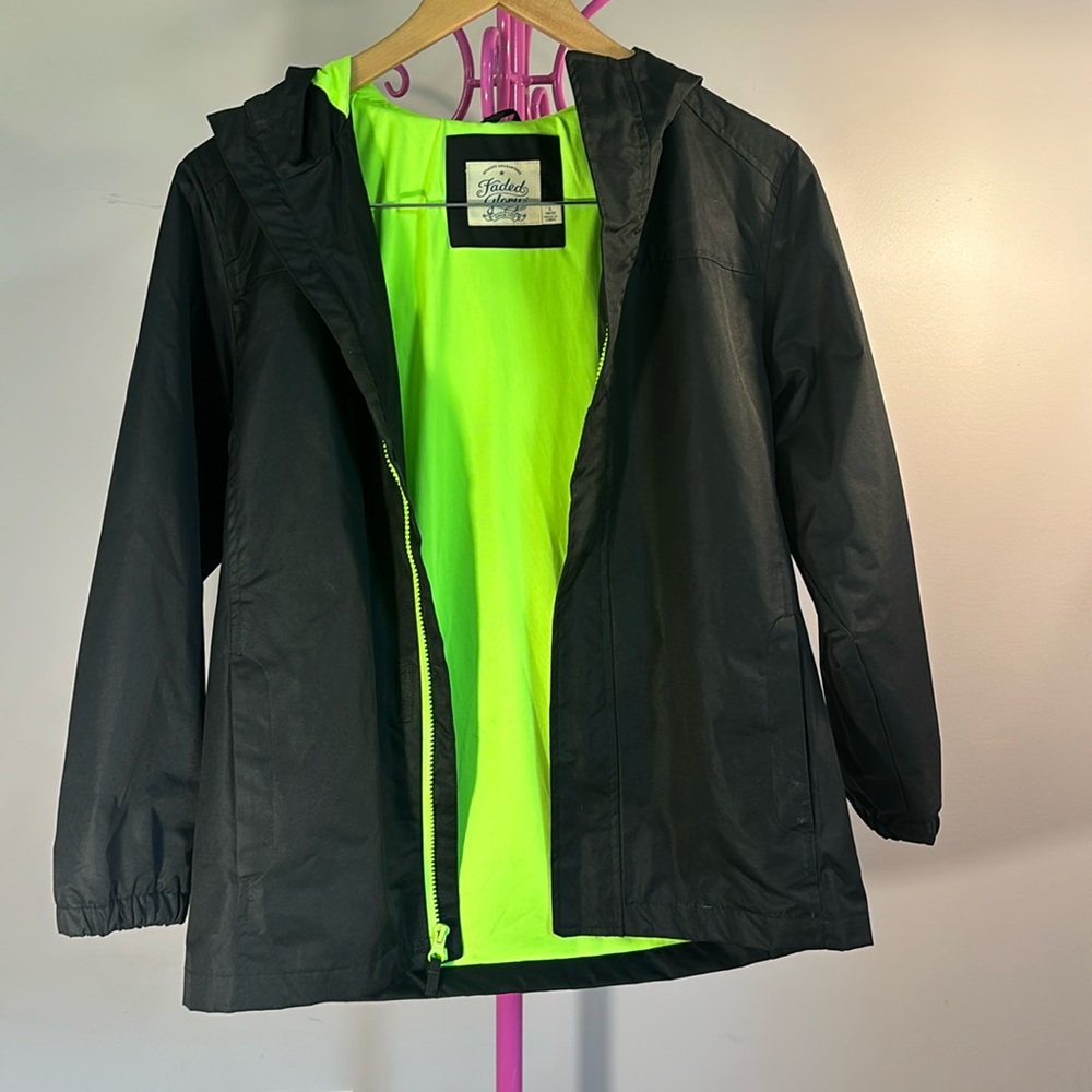 Boys large 10/12 raincoat. In good condition. Has multiple pockets.